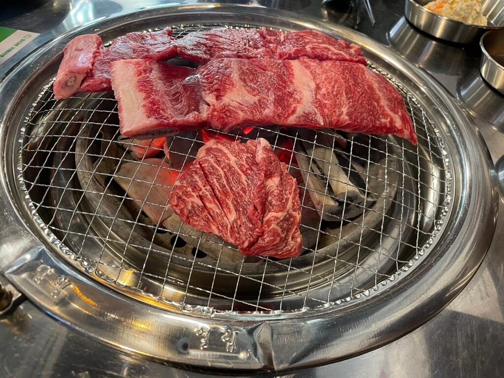 Beef grilling at a Korean barbecue table